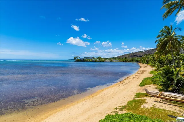 a view of a lake with a sunset