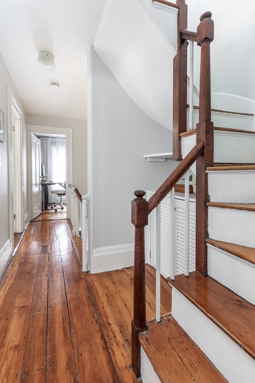 27 St James Street Boston, MA 02119 - Photo 18 of 26 a view of entryway and hall with wooden floor