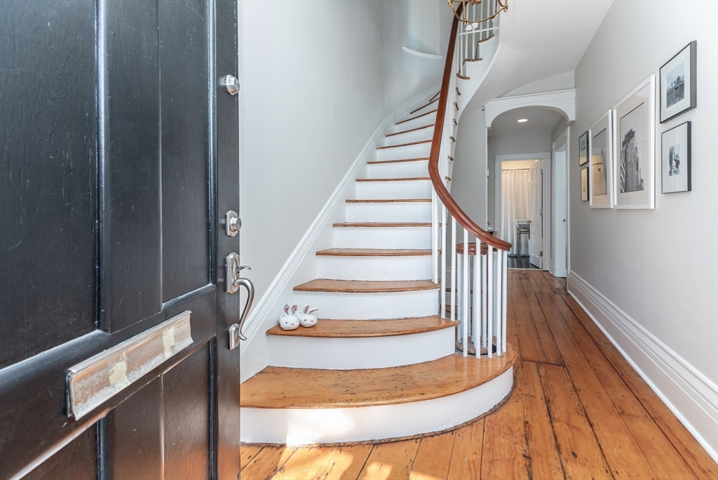 27 St James Street Boston, MA 02119 - Photo 5 of 26 a view of entryway and hall with wooden floor