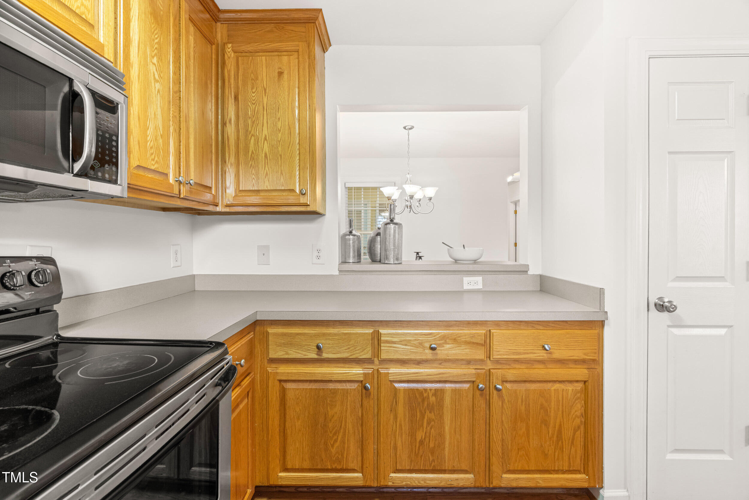 2221 Mountain Mist Court, Unit 201 Raleigh, NC 27603 - Photo 12 of 26 a kitchen with a sink and cabinets