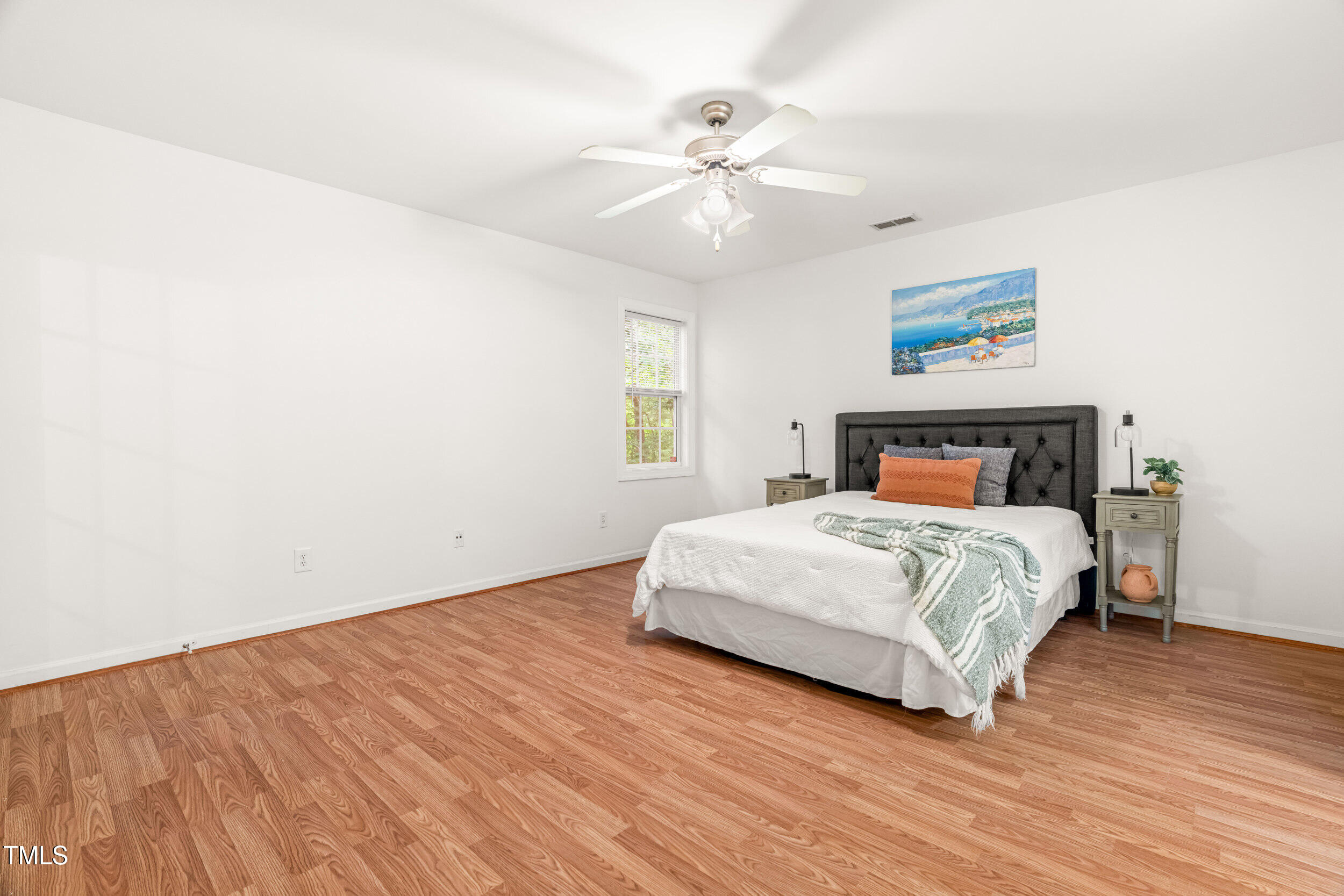 2221 Mountain Mist Court, Unit 201 Raleigh, NC 27603 - Photo 18 of 26 a bedroom with a bed and a chandelier
