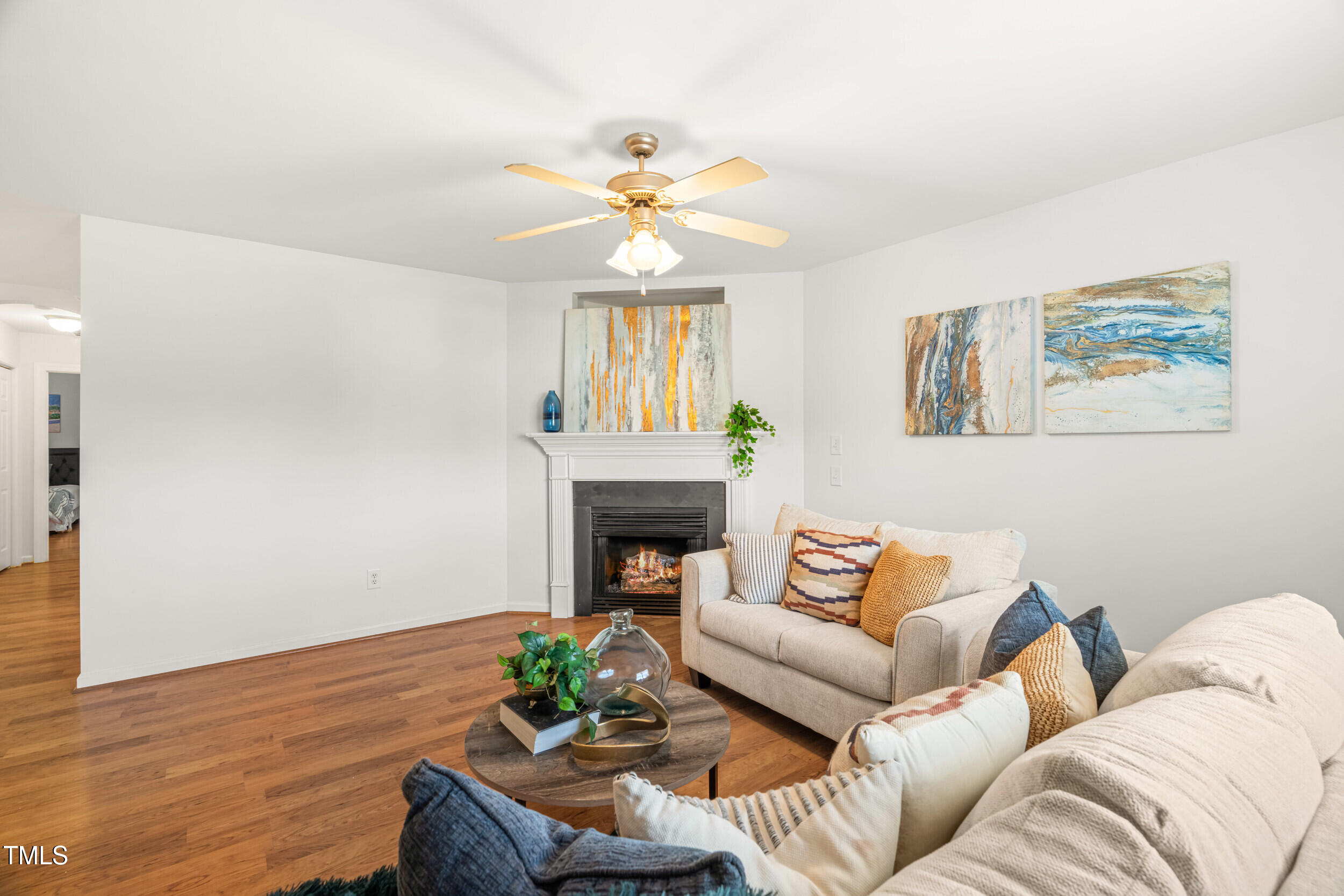 2221 Mountain Mist Court, Unit 201 Raleigh, NC 27603 - Photo 2 of 26 a living room with furniture and a fireplace