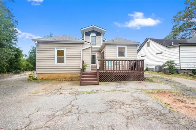 a view of a house with a snow in the yard