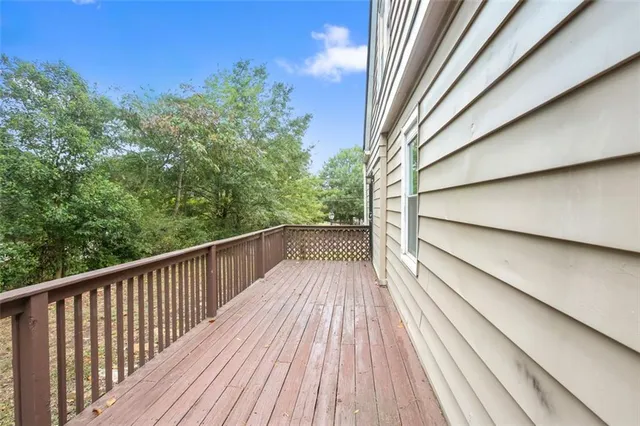 a view of balcony with wooden floor