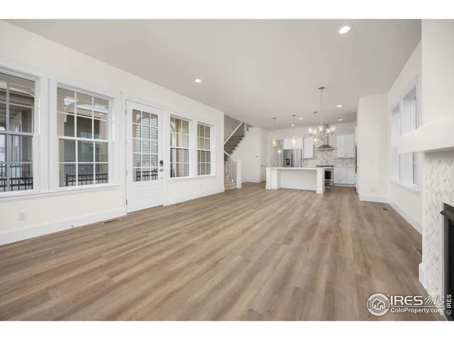 a view of a living room and wooden floor
