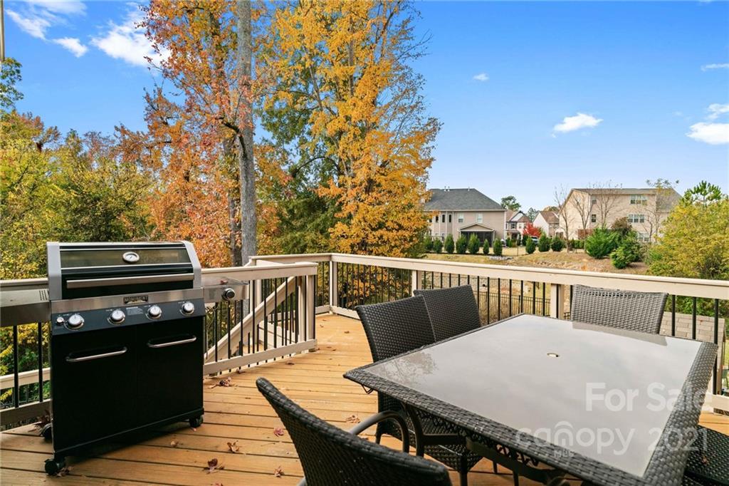 16024 Loch Raven Road Huntersville, NC 28078 - Photo 16 of 45 a view of a roof deck with wooden floor and fence