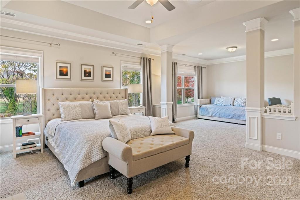 16024 Loch Raven Road Huntersville, NC 28078 - Photo 17 of 45 a spacious bedroom with a large bed and furniture