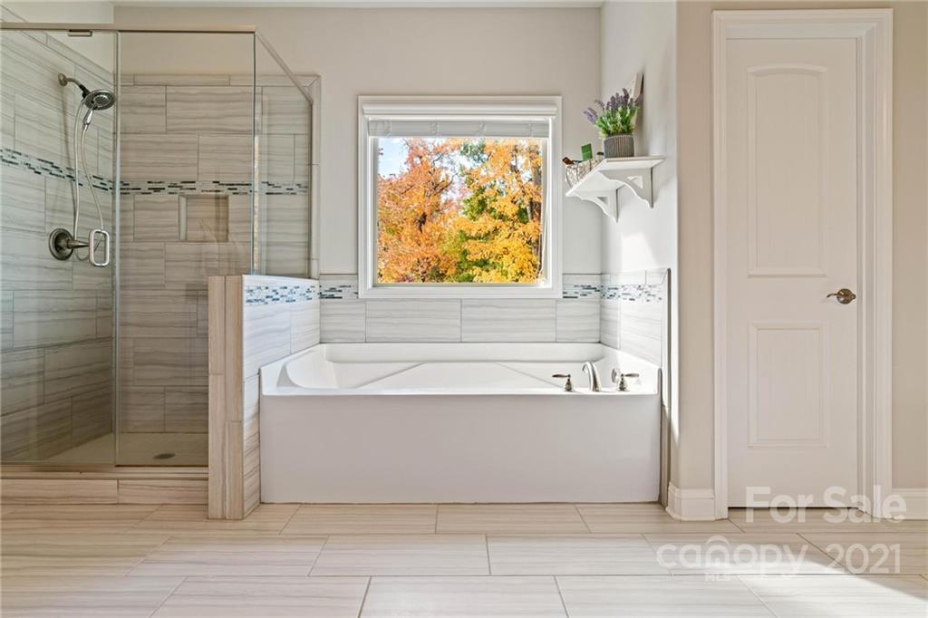 16024 Loch Raven Road Huntersville, NC 28078 - Photo 19 of 45 a bathroom with a bathtub and shower
