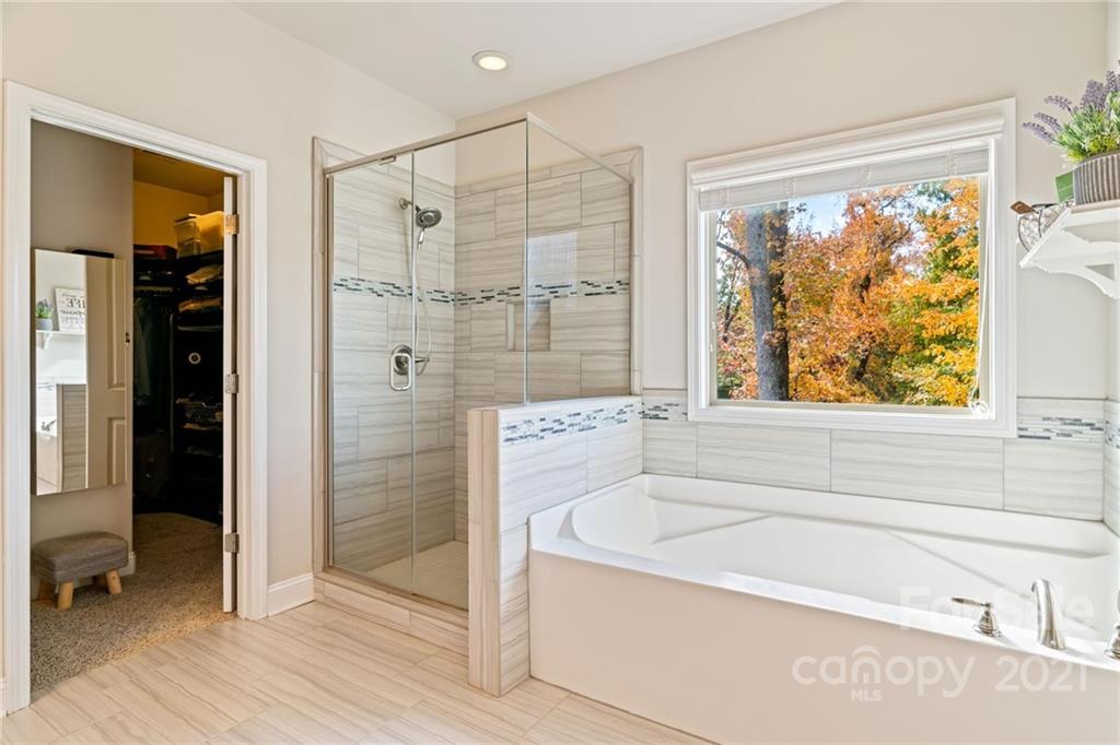 16024 Loch Raven Road Huntersville, NC 28078 - Photo 20 of 45 a bathroom with a bathtub and a shower