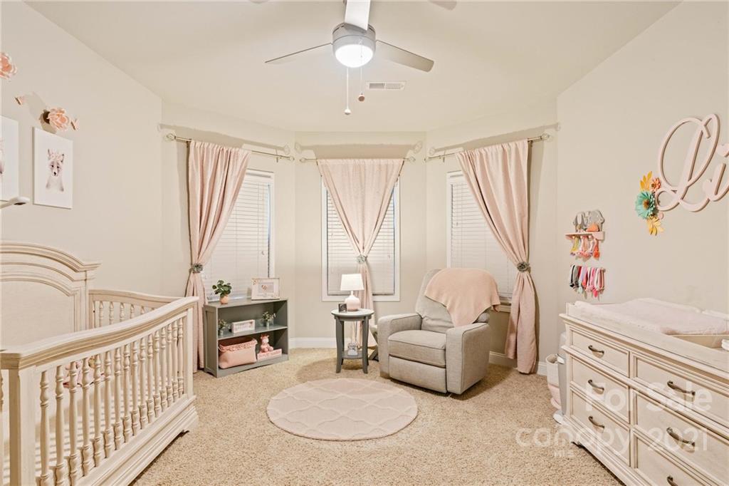 16024 Loch Raven Road Huntersville, NC 28078 - Photo 22 of 45 a living room with furniture and a large window