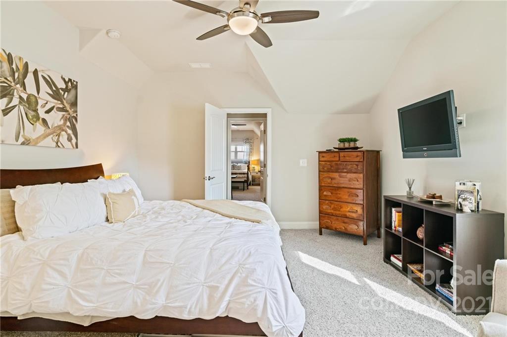 16024 Loch Raven Road Huntersville, NC 28078 - Photo 27 of 45 a bedroom with a bed and a flat screen tv