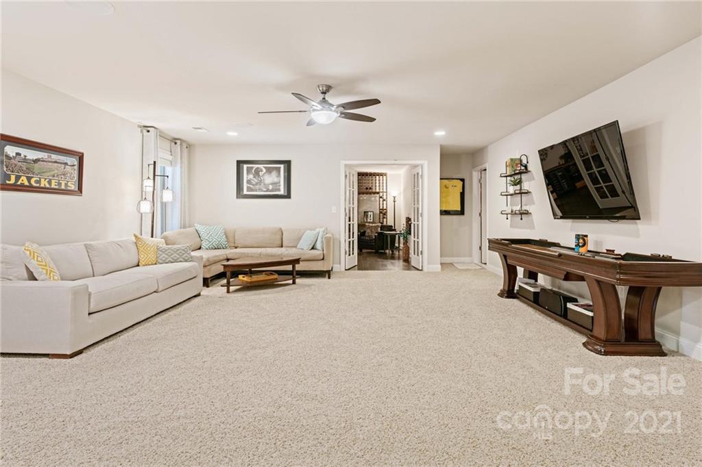 16024 Loch Raven Road Huntersville, NC 28078 - Photo 31 of 45 a living room with furniture and a flat screen tv
