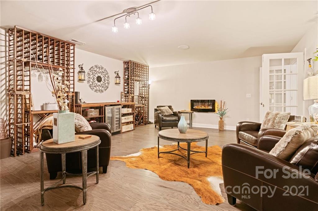 16024 Loch Raven Road Huntersville, NC 28078 - Photo 37 of 45 a living room with furniture and a painting