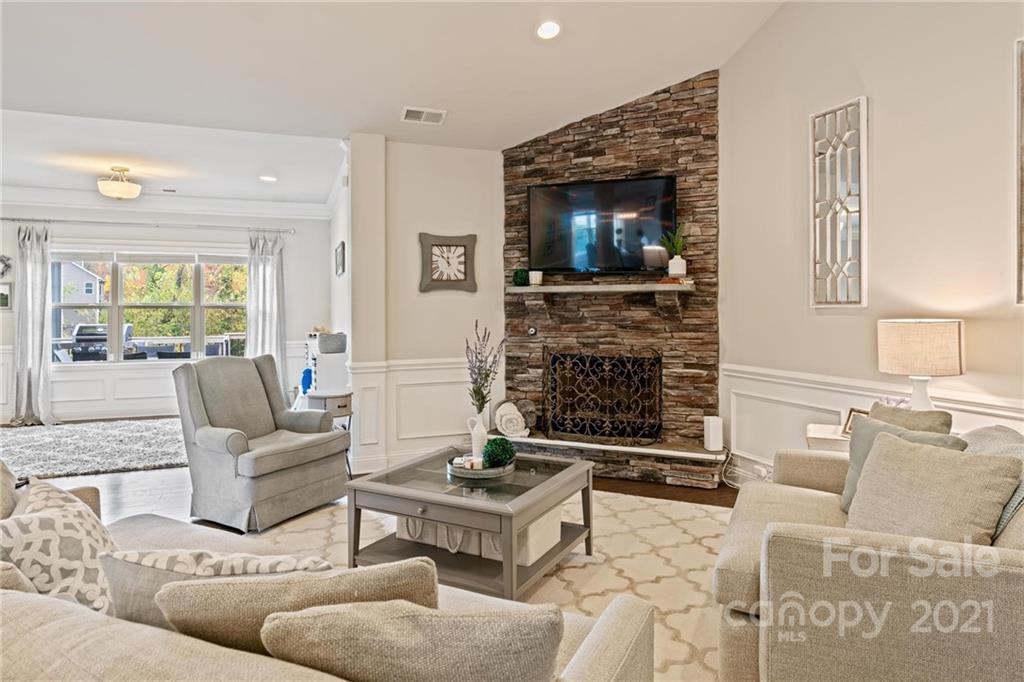 16024 Loch Raven Road Huntersville, NC 28078 - Photo 8 of 45 a living room with furniture and a fireplace
