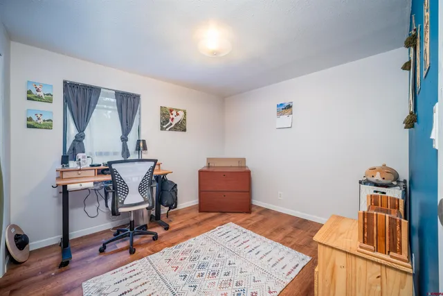 a workspace with furniture and window