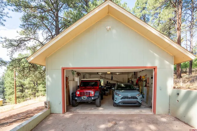 a view of parking garage with cars