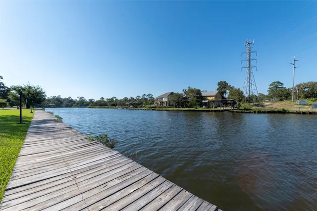 a view of a lake with boats and trees in the background