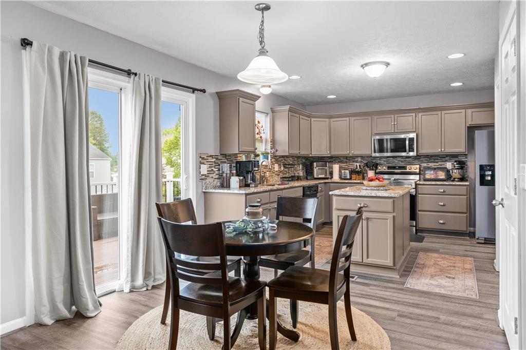 421 Colt Circle Clinton, PA 15026 - Photo 13 of 32 a view of a dining room with furniture window and wooden floor