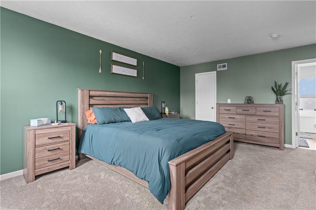 421 Colt Circle Clinton, PA 15026 - Photo 18 of 32 a bedroom with a bed and a dresser