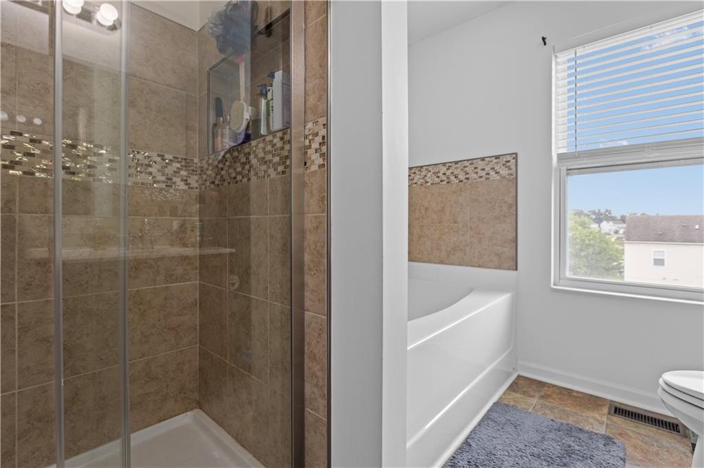 421 Colt Circle Clinton, PA 15026 - Photo 20 of 32 a bathroom with a tub a toilet and a shower