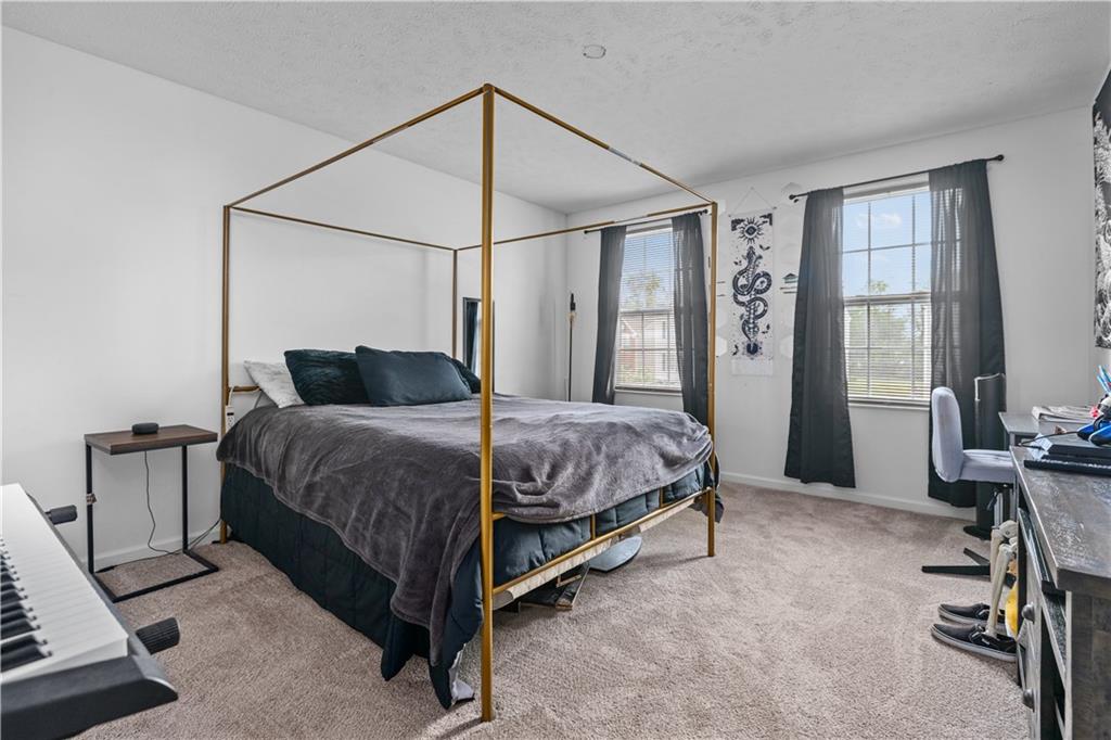 421 Colt Circle Clinton, PA 15026 - Photo 21 of 32 a bedroom with a bed closet and a window