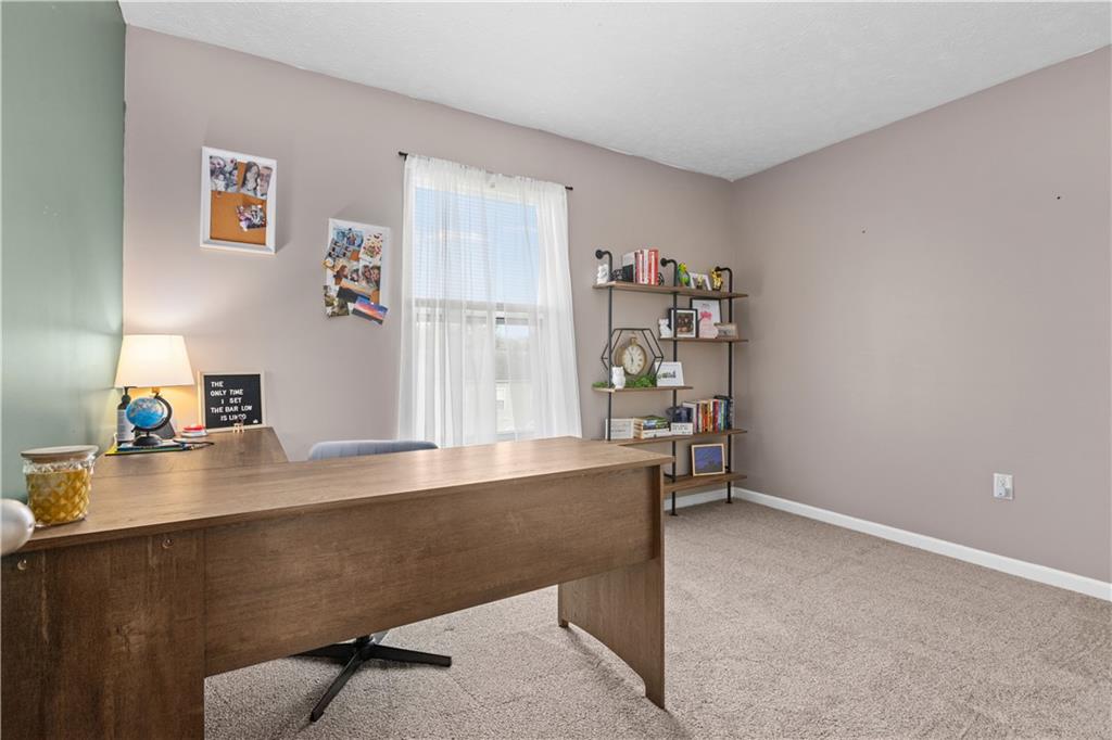 421 Colt Circle Clinton, PA 15026 - Photo 23 of 32 a room with a desk and book shelf