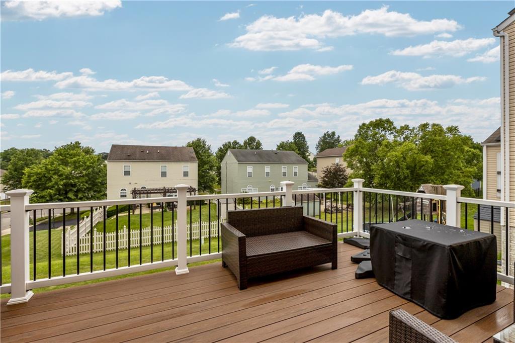 421 Colt Circle Clinton, PA 15026 - Photo 30 of 32 a view of a balcony with wooden floor and iron stairs