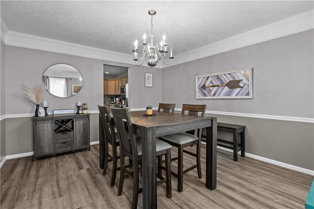 421 Colt Circle Clinton, PA 15026 - Photo 8 of 32 a view of a dining room with furniture and wooden floor
