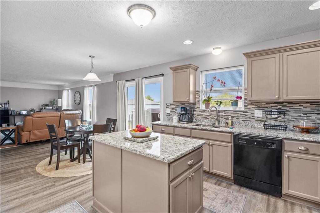 421 Colt Circle Clinton, PA 15026 - Photo 9 of 32 a kitchen with a sink stove and cabinets
