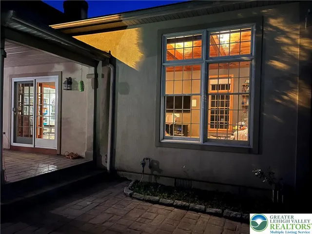 a kitchen with stainless steel appliances granite countertop a sink a stove and a wooden cabinets