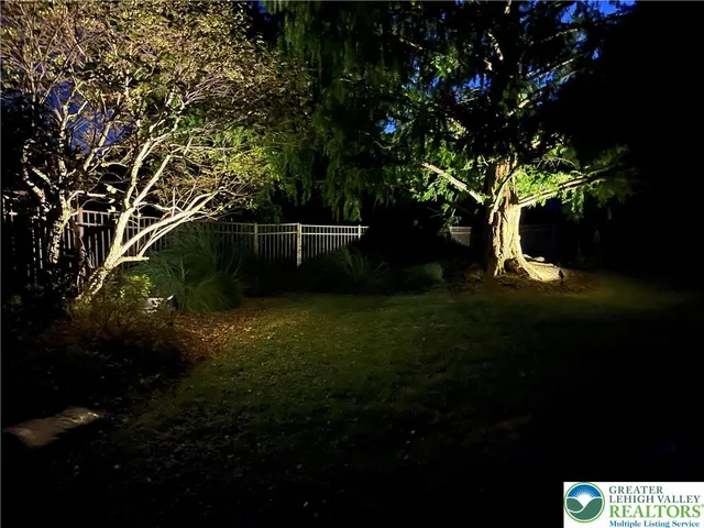 a kitchen with stainless steel appliances granite countertop a refrigerator a sink a stove a microwave a counter top and cabinets