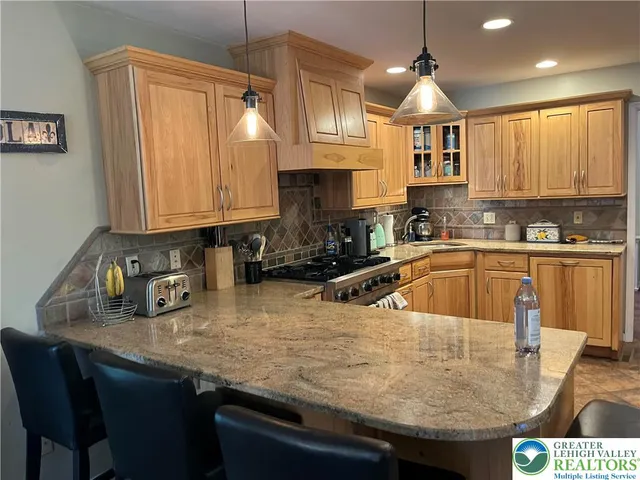 a living room with dining table and a wooden floor