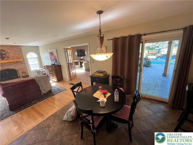 a living room with furniture window and a fireplace