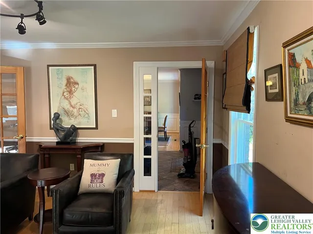 a bathroom with a tub a sink and a large mirror