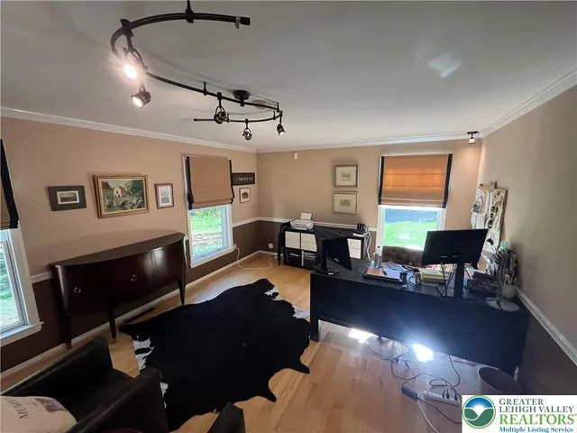 a en suite bathroom with a granite countertop double vanity sink a mirror and a bathtub