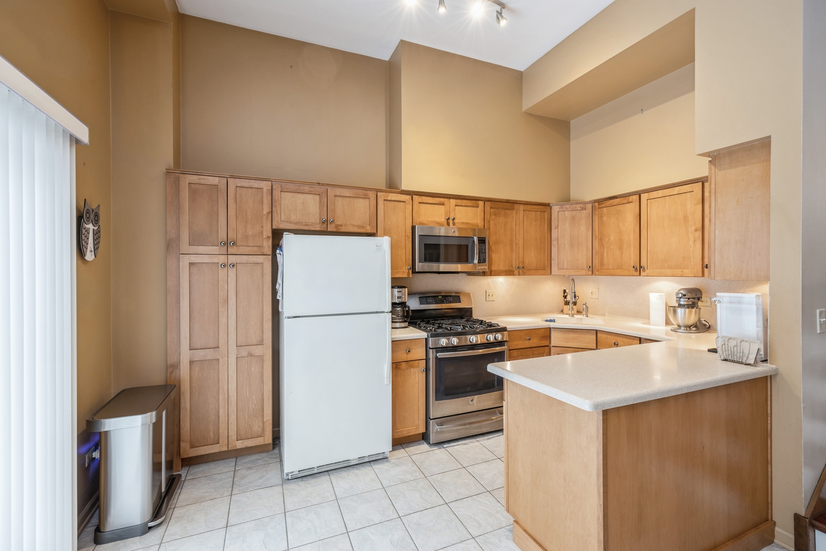 4425 Forest Avenue Brookfield, IL 60513 - Photo 4 of 12 a kitchen with a refrigerator sink and stove