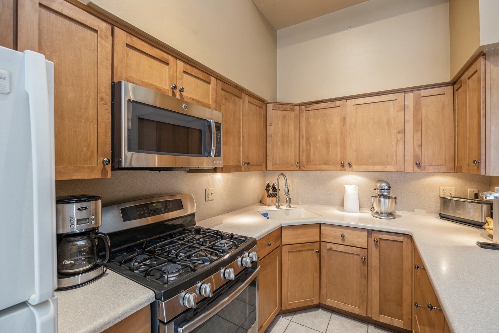 4425 Forest Avenue Brookfield, IL 60513 - Photo 5 of 12 a kitchen with stainless steel appliances a stove sink microwave and cabinets