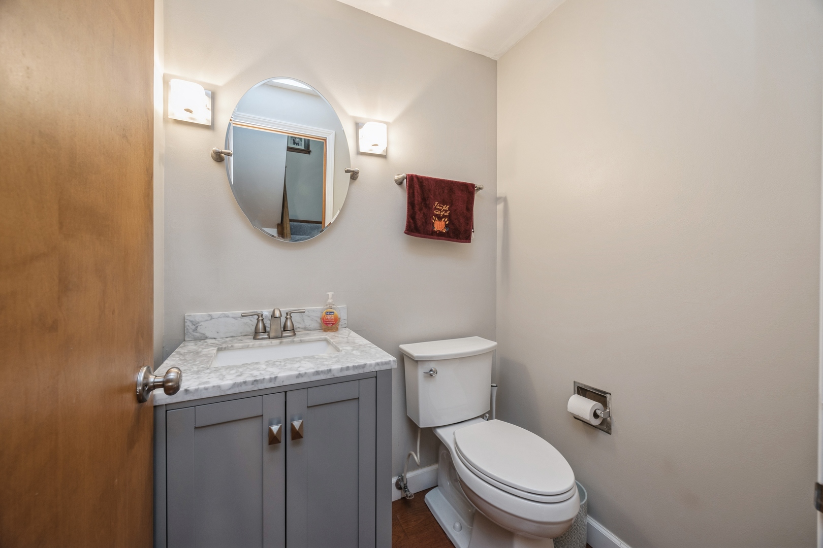 4425 Forest Avenue Brookfield, IL 60513 - Photo 7 of 12 a bathroom with a toilet sink and mirror