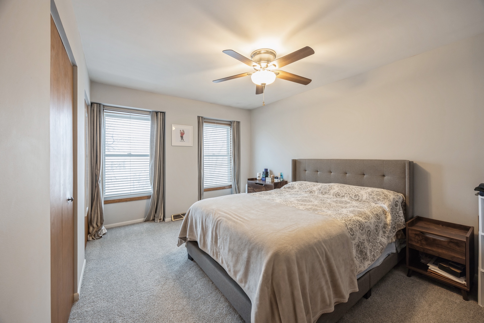 4425 Forest Avenue Brookfield, IL 60513 - Photo 8 of 12 a bedroom with a bed and a chandelier