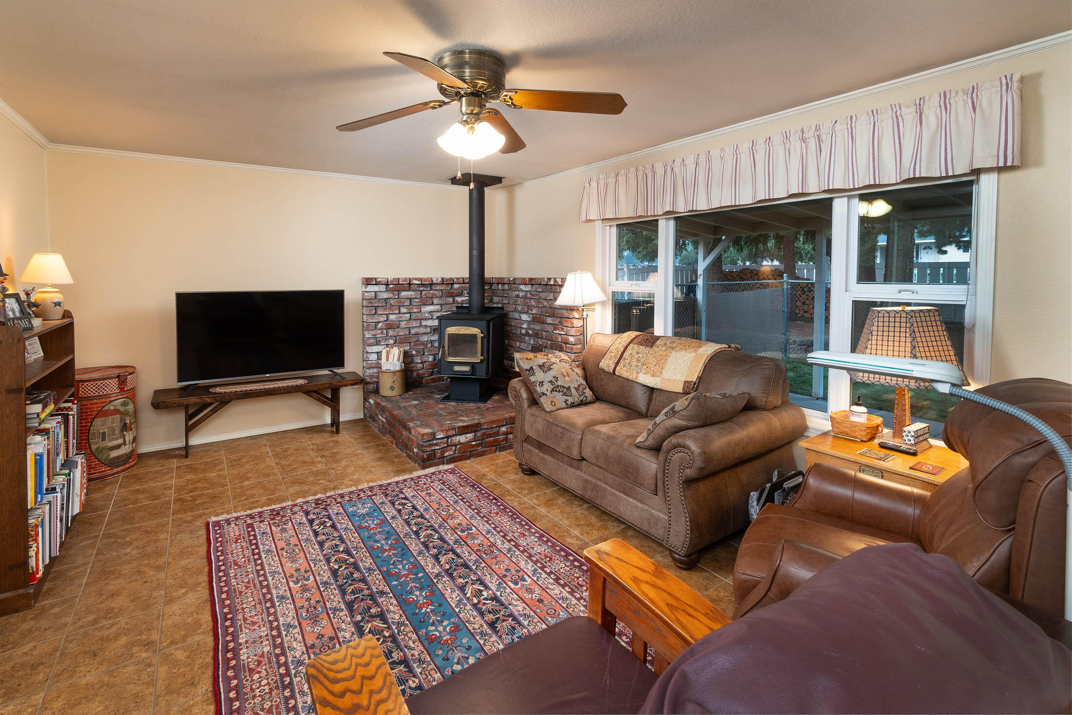21665 Old Red Road Bend, OR 97702 - Photo 11 of 34 Family room with bricked hearth for a wood stove.