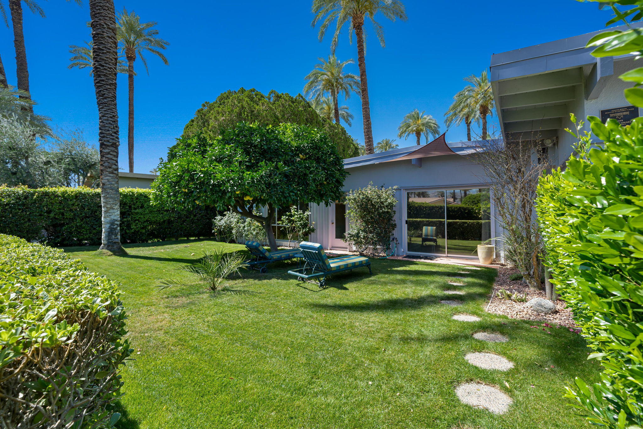 70418 Tamarisk Lane Rancho Mirage, CA 92270 - Photo 15 of 41 a view of a chair and table in backyard of the house