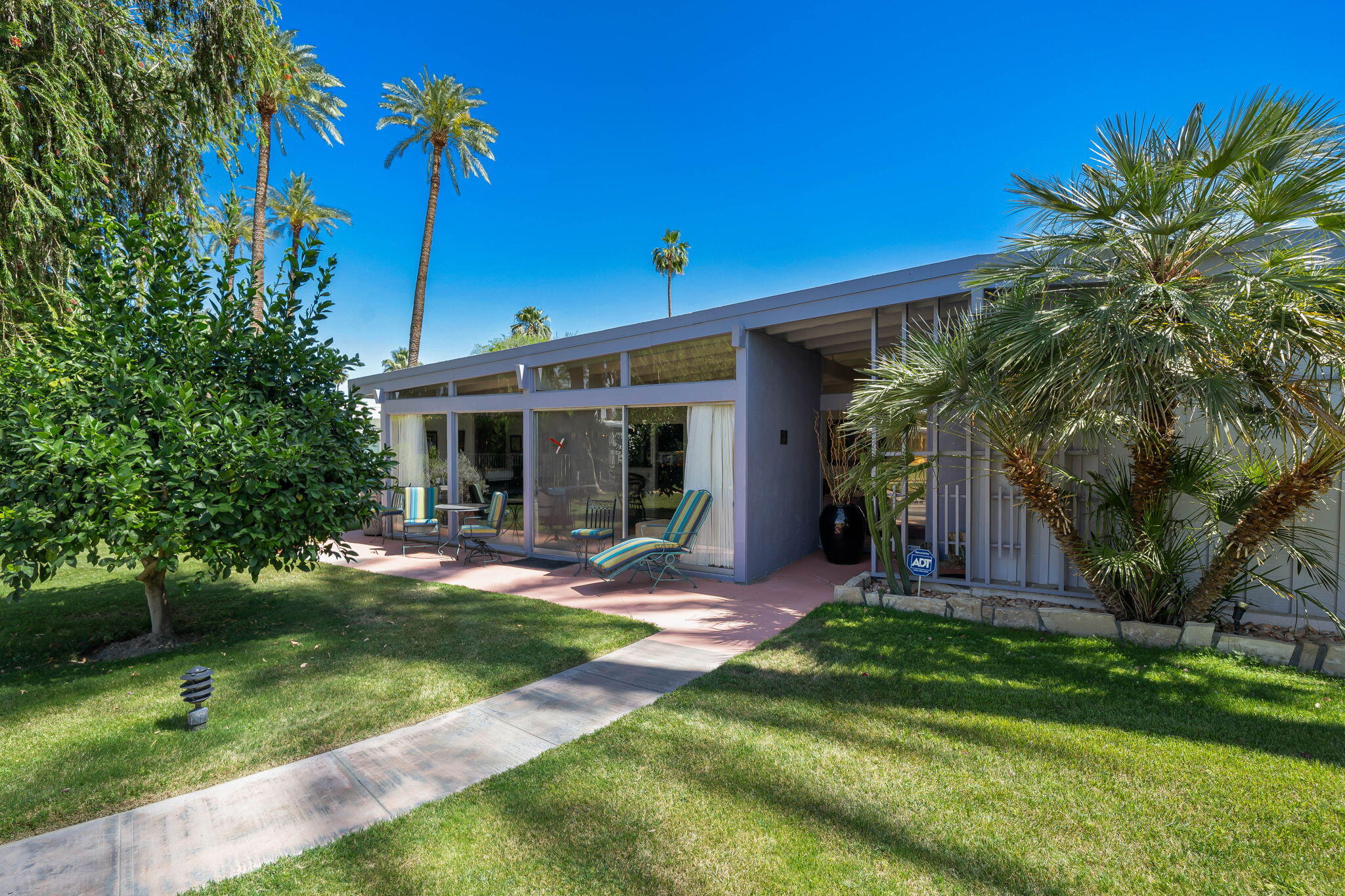 70418 Tamarisk Lane Rancho Mirage, CA 92270 - Photo 20 of 41 front view of a house with a yard