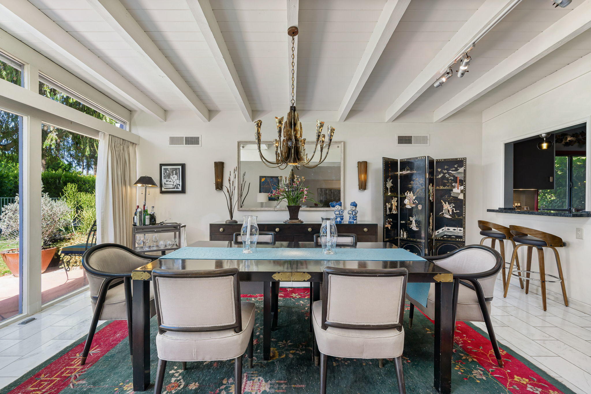 70418 Tamarisk Lane Rancho Mirage, CA 92270 - Photo 27 of 41 a view of a dining room with furniture and a chandelier