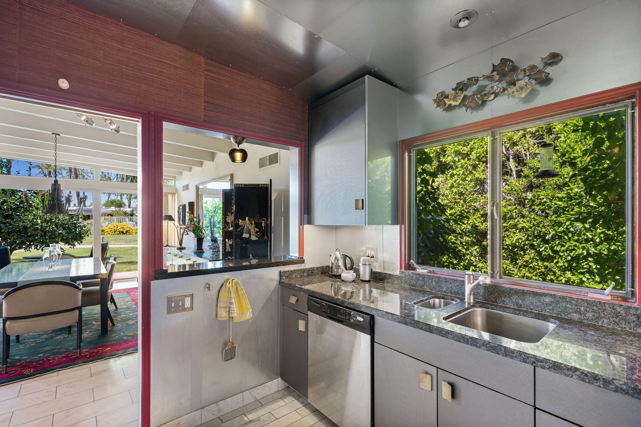 70418 Tamarisk Lane Rancho Mirage, CA 92270 - Photo 30 of 41 a kitchen with a sink and large window
