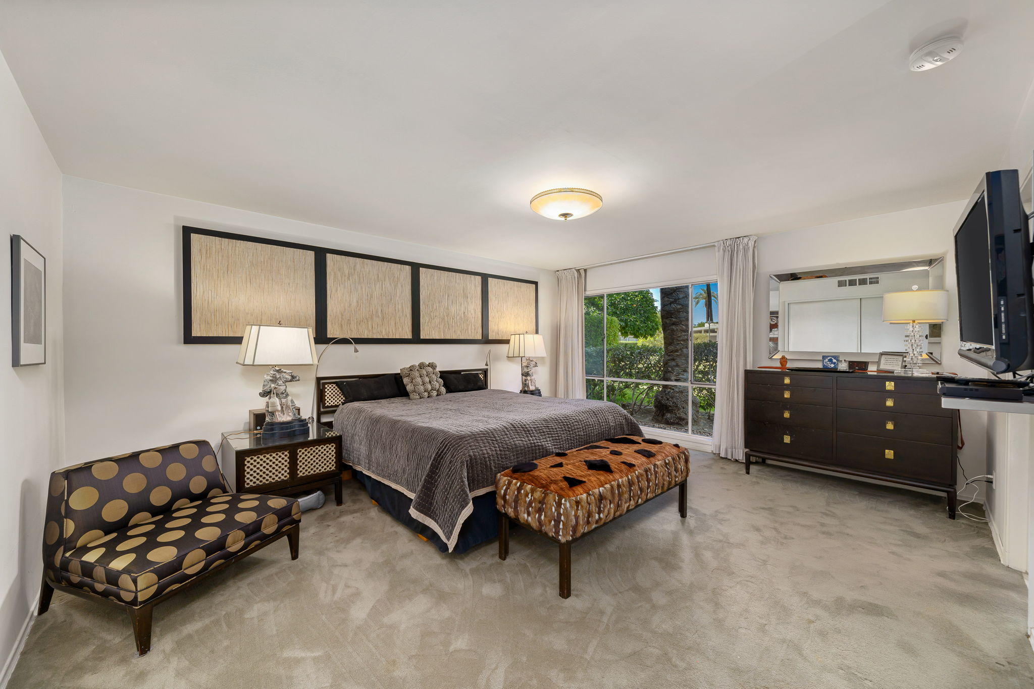70418 Tamarisk Lane Rancho Mirage, CA 92270 - Photo 39 of 41 a bedroom with a bed couch and window