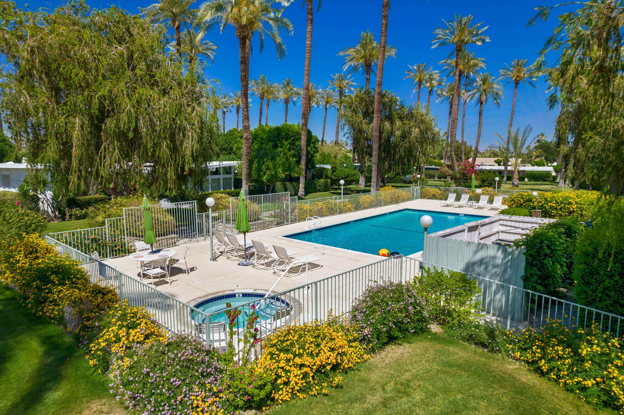 70418 Tamarisk Lane Rancho Mirage, CA 92270 - Photo 9 of 41 a view of a swimming pool with a patio and a yard