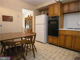 867 Kent Lane Philadelphia, PA 19115 - Photo 4 of 6 a kitchen with stainless steel appliances a refrigerator and a stove top oven