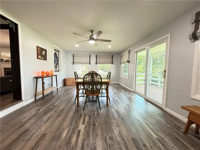 a dining room with furniture and wooden floor