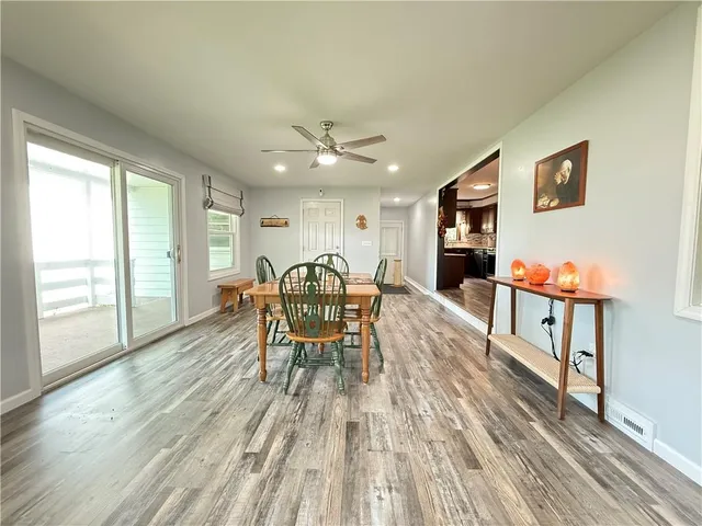an outdoor space with furniture window and wooden floor