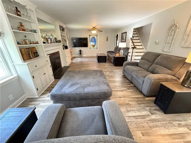 a bedroom with furniture and a fireplace